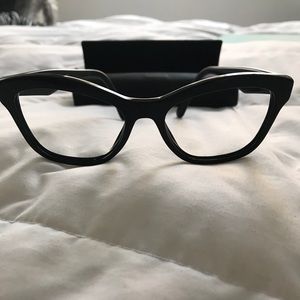 Prada eyeglass frames.